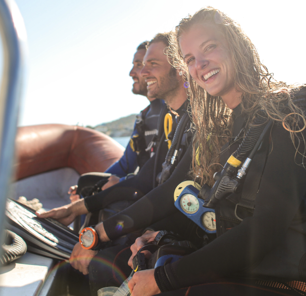 group of three scuba divers