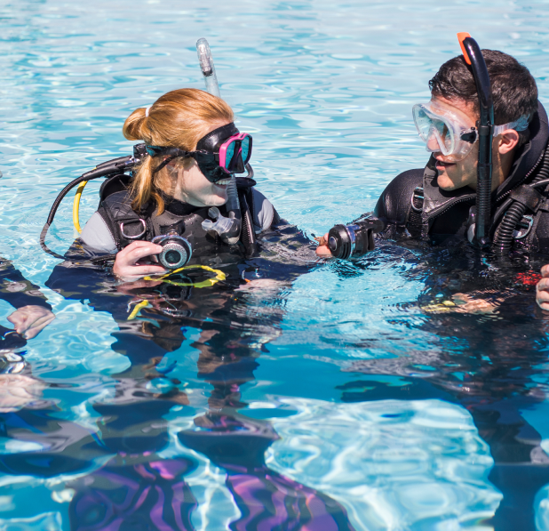 two students in the water during scuba training