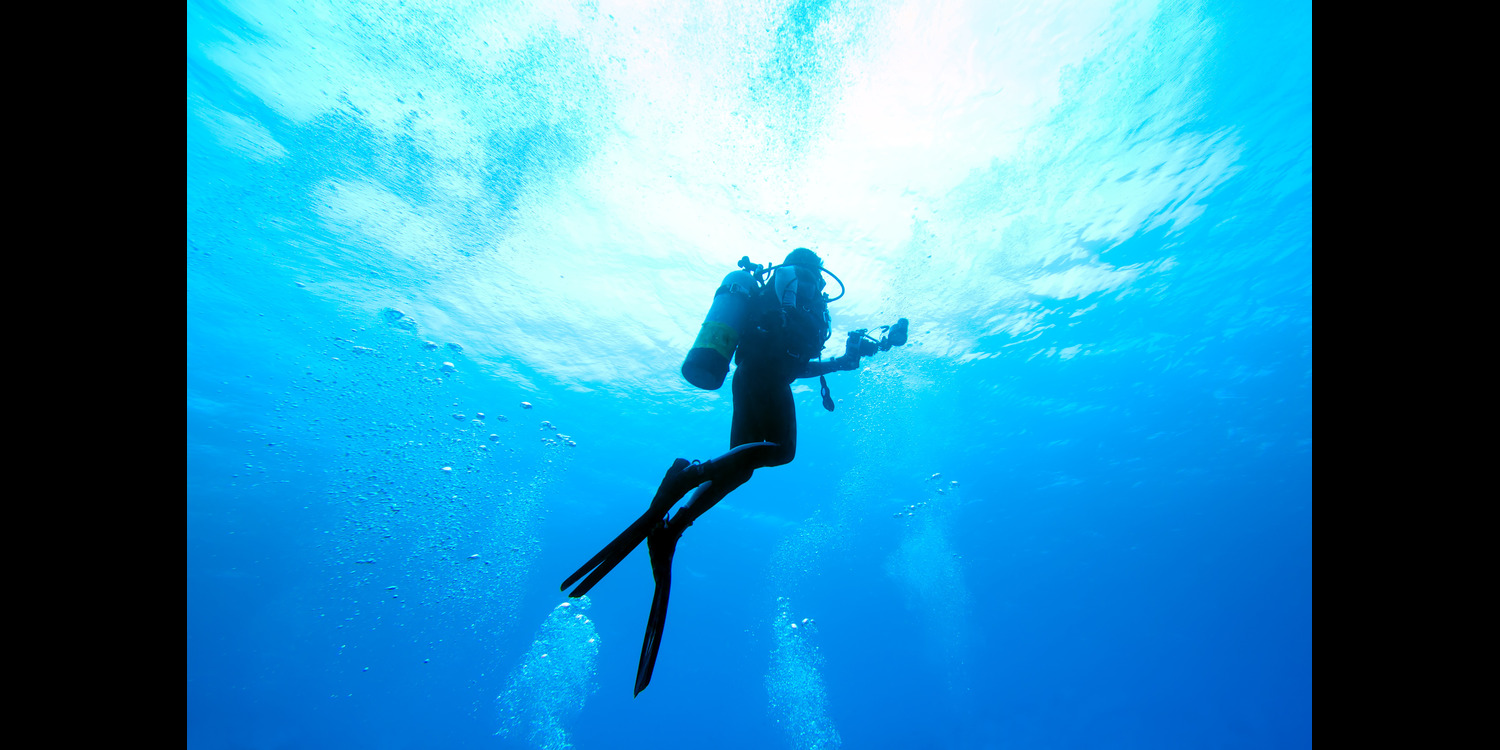 Scuba Diver Rising in the Ocean