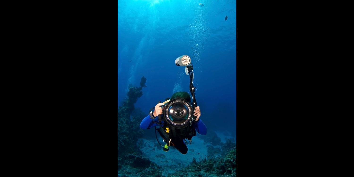 a diver performing scuba diving photography