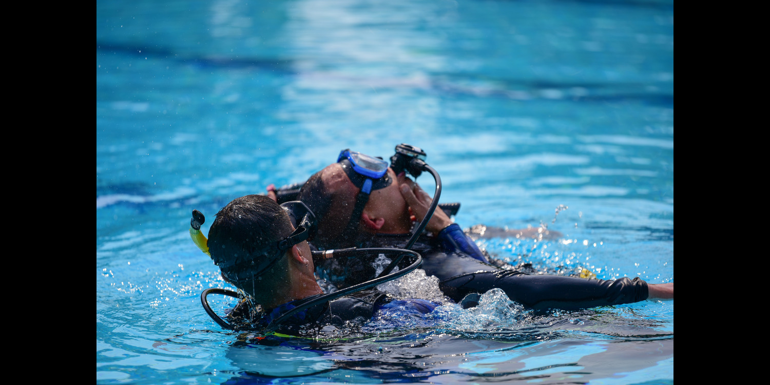 SDI Rescue Diver Course student practicing in a pool